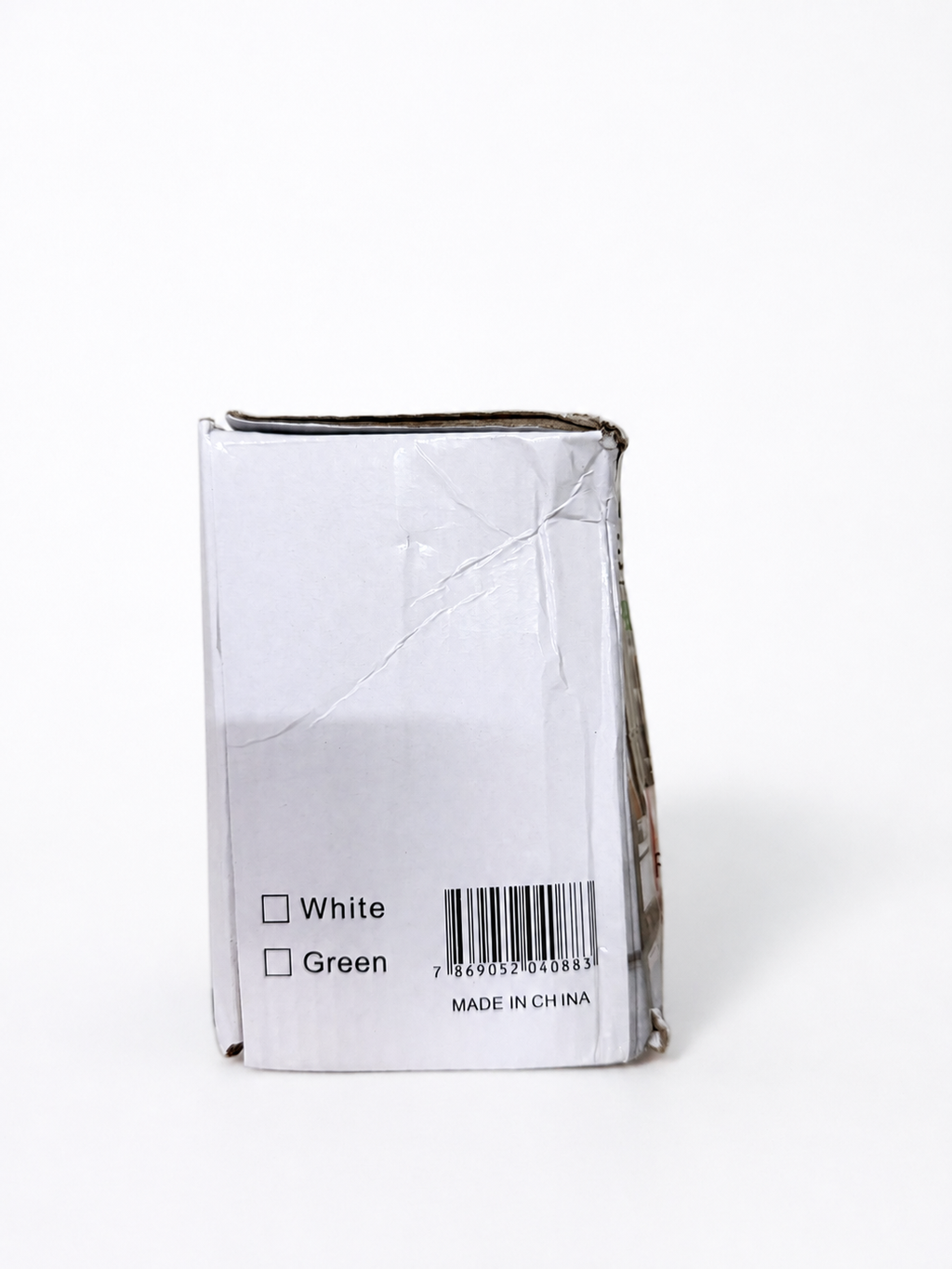 Side of electric cleaning brush box showing white color and EAN barcode