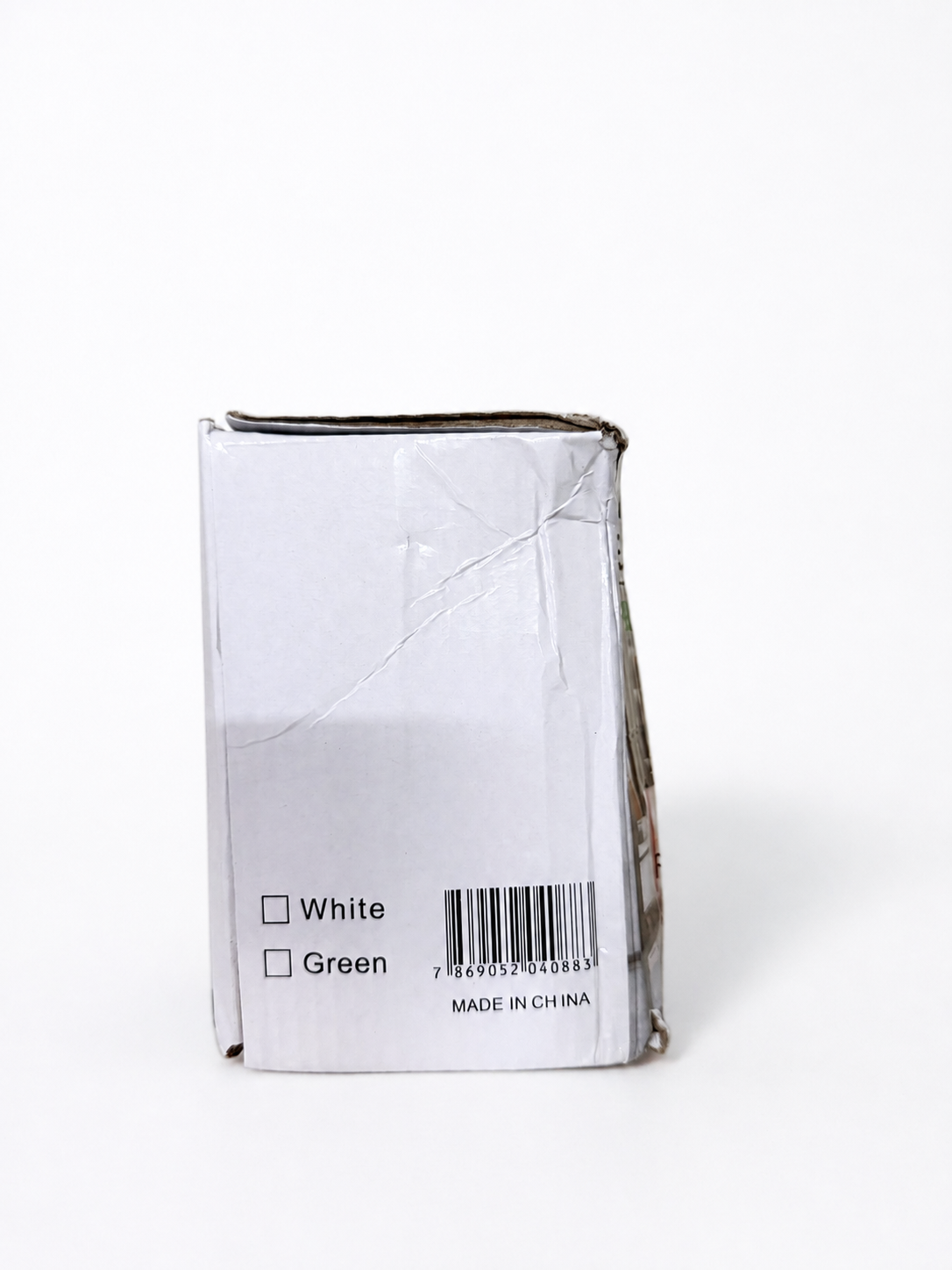 Side of electric cleaning brush box showing white color and EAN barcode